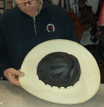 Step 6: Spray the brim with water to soften up the pies, then press it down evenly over the crown of the helmet. Position so it sits the way you want it when the helmet is on your head. The front of the hat should sit down on the helmet visor. (They like the Tipperary Sportage because it has a short visor that is not seen under the hat brim).